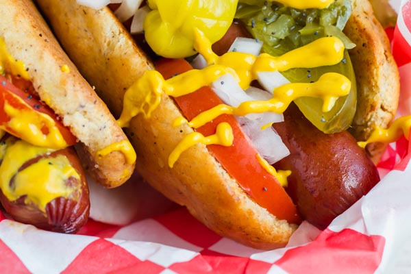 thick fluffy keto hot dog buns on a parchment lined tray