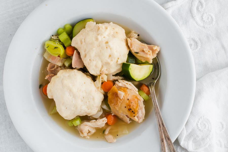 big bowl of chicken and dumplings with lots of vegetables