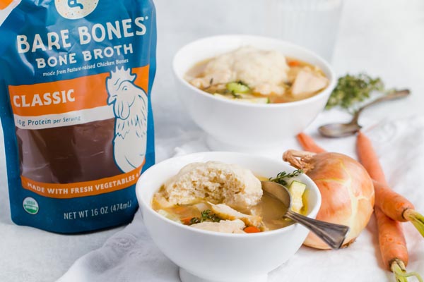 two bowls of chicken and dumplings with bone broth