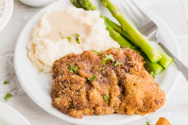 thick, crispy fried steak on a plate