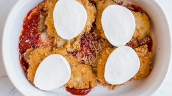 layering chicken parmesan