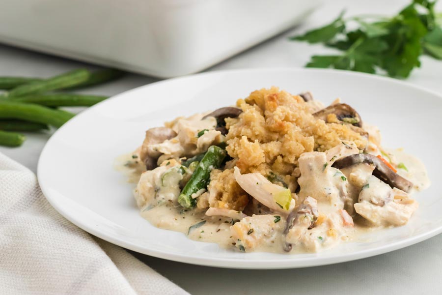 Chicken pot pie casserole on a white plate.