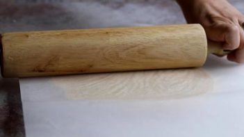 rolling out pie crust with a rolling pin