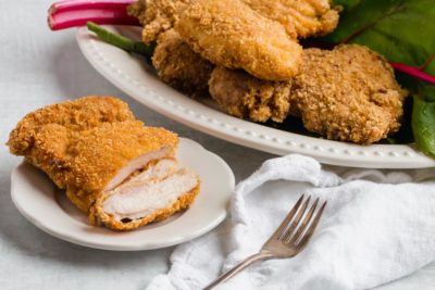 sliced up low carb chicken schnitzel on a plate