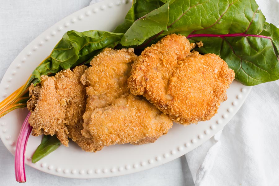 keto breaded chicken on rainbow chard