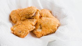 pork panko crusted chicken thighs cooking in avocado oil