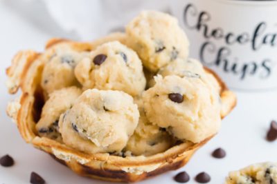 a bowl with a bunch of edible cookie dough balls in it