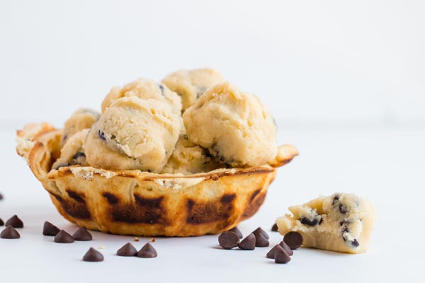 a waffle bowl with balls of cookie dough fat bombs in them