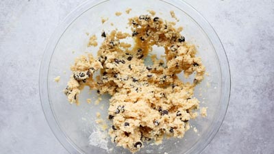 Chocolate chip cookie dough in a glass bowl