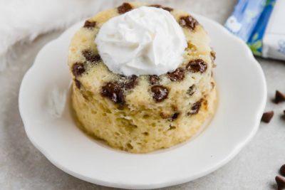 keto chocolate chip cake with a dollop of whipped cream on top