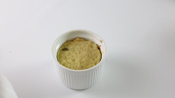 baked keto mug cake in a white ramekin