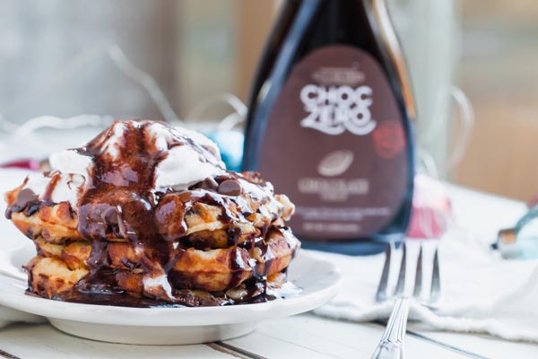 keto waffles topped with chocolate syrup