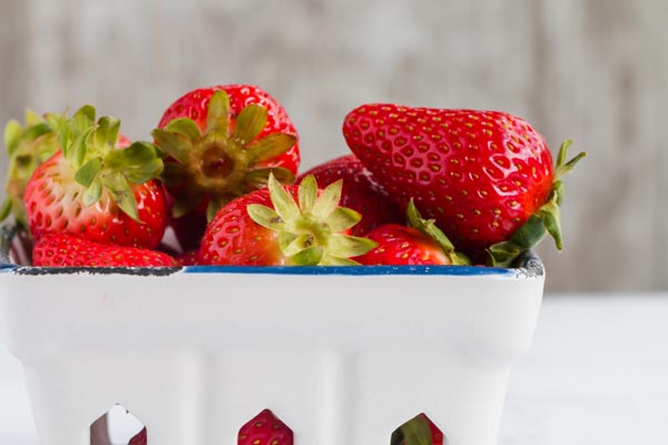 fresh strawberries in a white basket