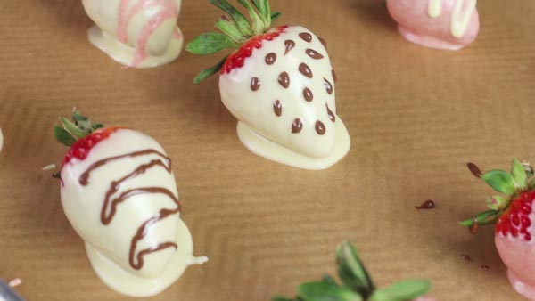 keto chocolate covered strawberries on a parchment paper