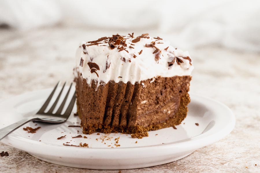 a fork bite out a chocolate pie