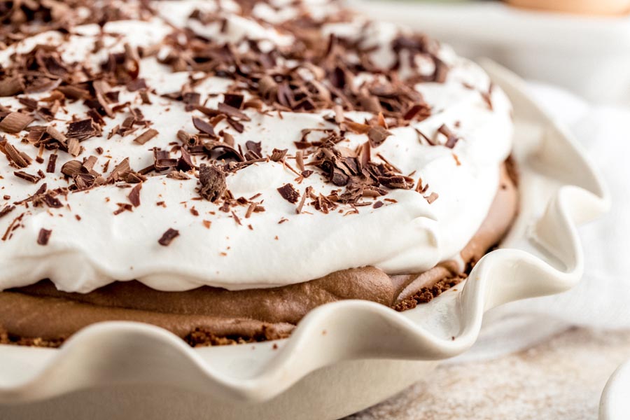 cream pie with whipped topping and chocolate crumbles on top