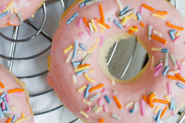 pink glazed donut with sugar free sprinkles on top