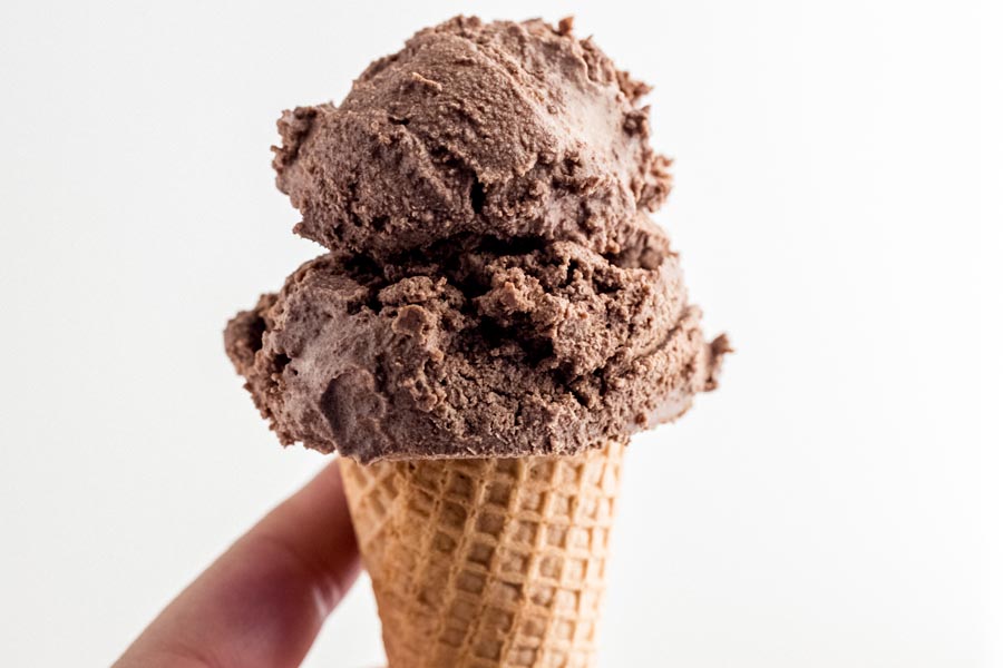 holding a cone of ice cream