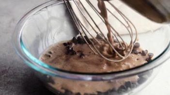 pouring a chocolate sauce over chocolate chips