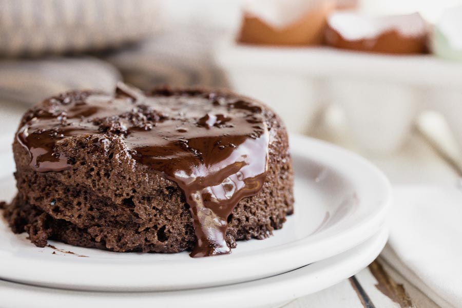 chocolate pouring down off the side of a lava cake