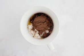 mini cake ingredients in a white coffee mug