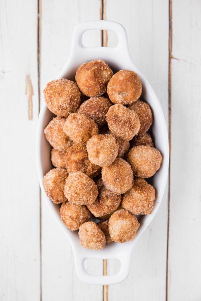 top down view of a pile of keto donut holes in a casserole dish