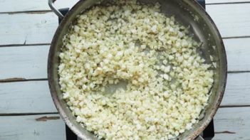 cooked cauliflower rice in a skillet