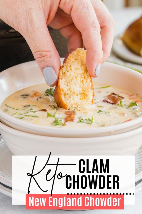 dipping a keto bread roll into a bowl of soup