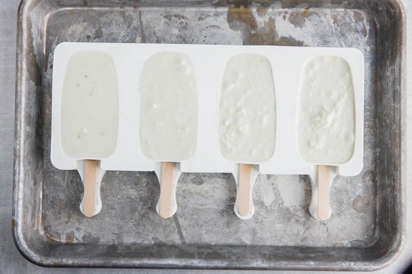 silcone popsicle mold filled with a cream mixture