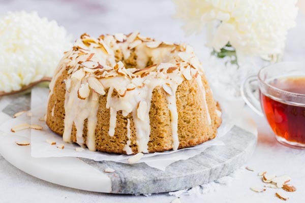a small coffee cake with icing drizzled down the sides