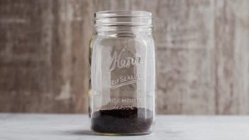 add ground coffee to mason jar