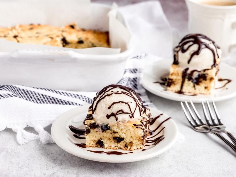 Cookie bars a la mode with vanilla ice cream and chocolate sauce.