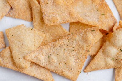 a bunch of tortilla chips coated with ranch seasoning