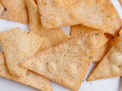 a bunch of tortilla chips coated with ranch seasoning