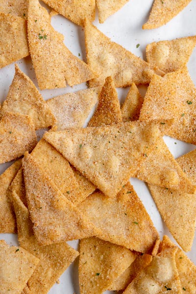 a bunch of cool ranch flavored homemade doritos scattered