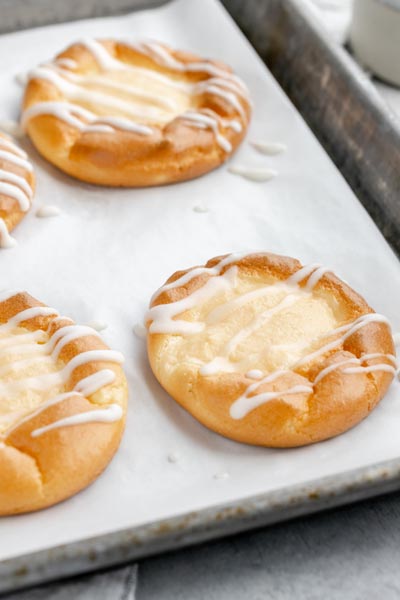 a baking pan with freshly baked danishes on top