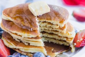 a stack of keto cream cheese pancakes sliced to show the insides