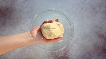 holding a ball of tortilla dough