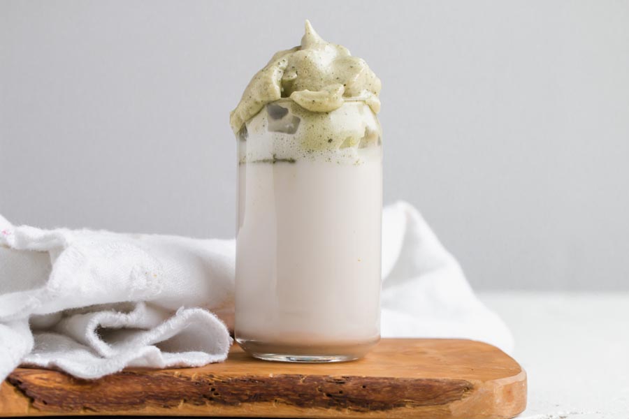 layered keto matcha latte with dalgona foam