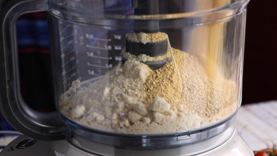 pouring lupin flour into a food processor