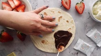 spread a chocolate spread on a tortilla