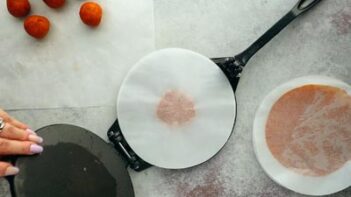 using a tortilla press to press tortilla into circle shape