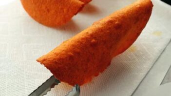 taco shells drying upside down on a paper towel