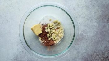 chocolate chip cookie ingredients in a clear bowl