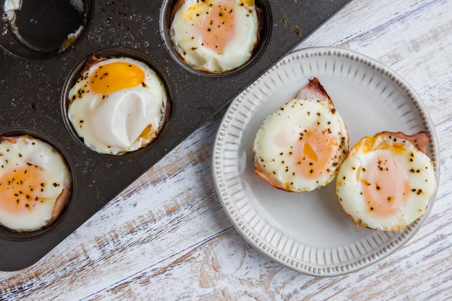 eggs baked in a muffin tin and on a small white plate