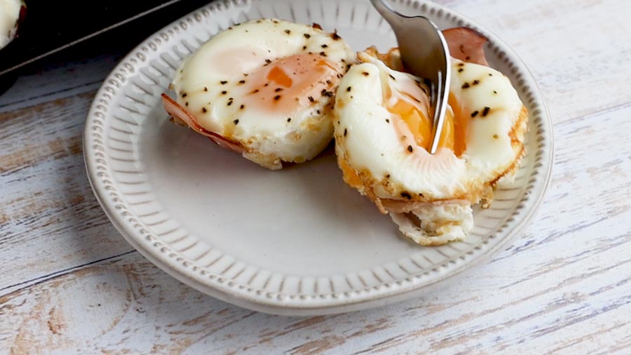 cutting into an egg yolk