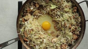 mushrooms and ground pork cooking a in skillet