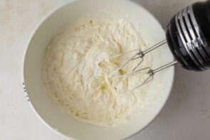 Heavy cream whipped with a hand mixer until stiff peaks form.