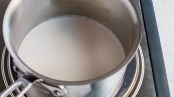 nut milk heating in a saucepan