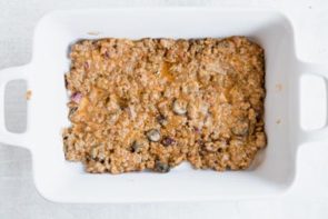 ground beef mixture in the bottom of a white casserole dish